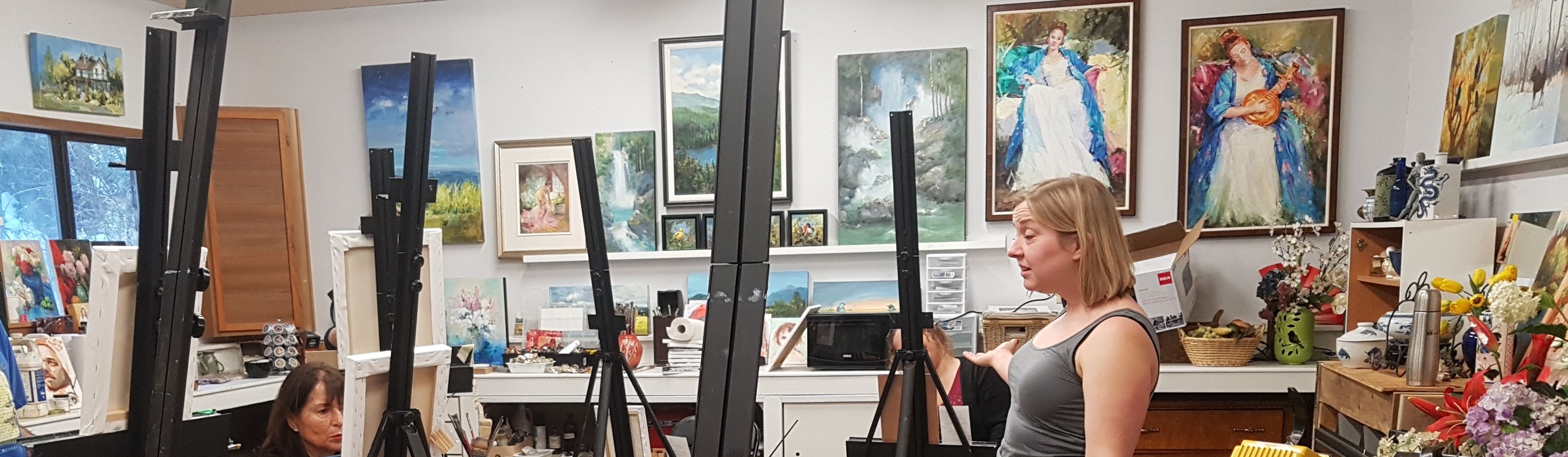 Group of Loft Studio artists gathered in the main workspace